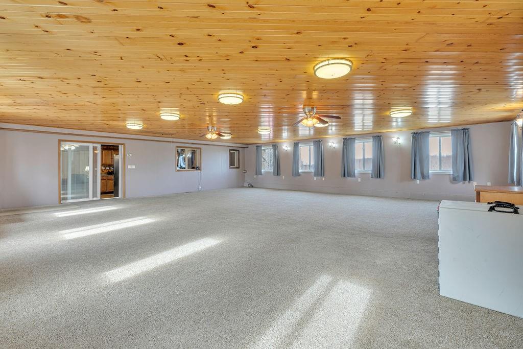 193 Salem Church Road Midland, PA 15059 - Photo 8 of 44 Expansive Family Room for the best of parties. View shows enclosed blinds slider doors to kitchen.