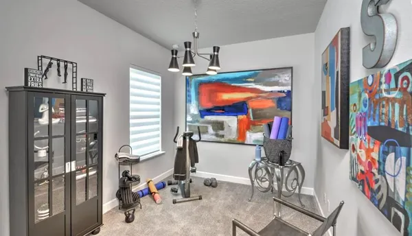 a very nice looking dining room with a table or chairs and a kitchen view