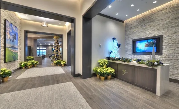 a living room with lots of furniture and a large window