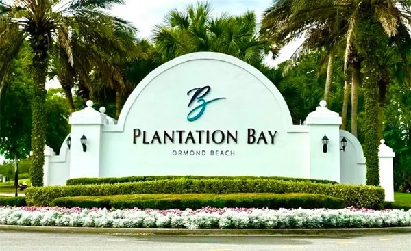 a view of a swimming pool with lounge chairs in patio