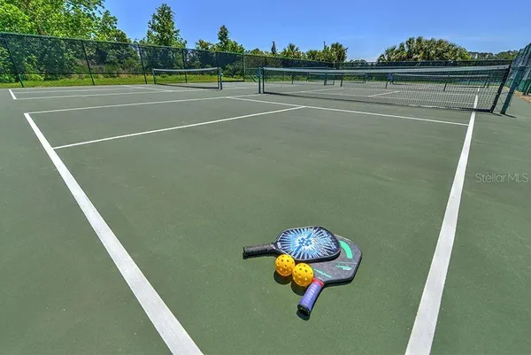 swimming pool view with a seating space