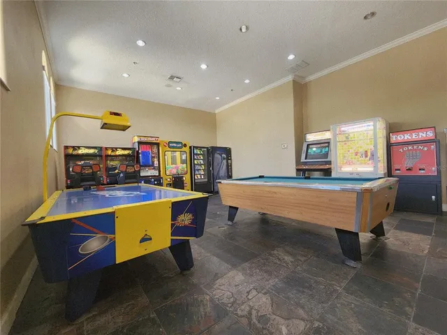 a room with wooden floors table and chairs