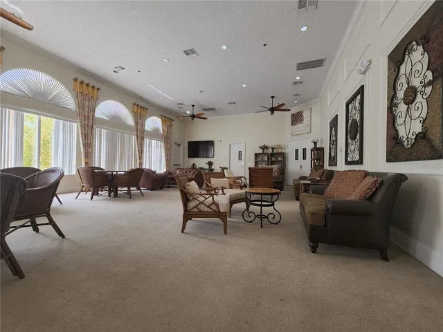a outdoor space with furniture a flat screen tv and a window