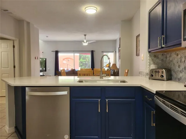 a kitchen with a sink and cabinets