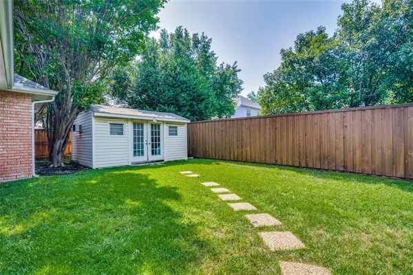 a view of a backyard with a garden