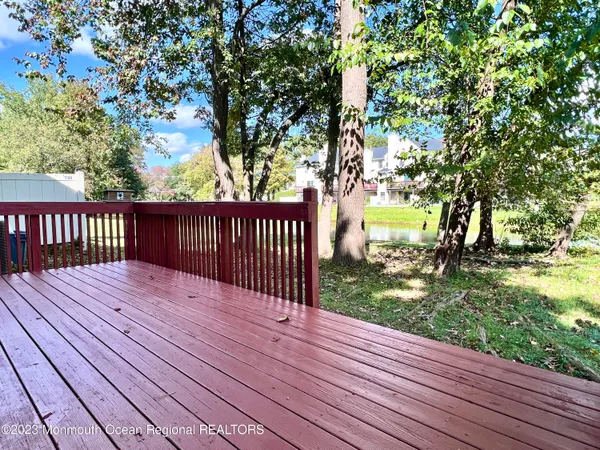 a view of deck with wooden floor and fence