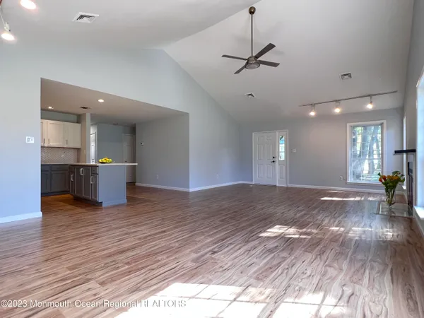 a view of a kitchen with a sink and a stove top oven