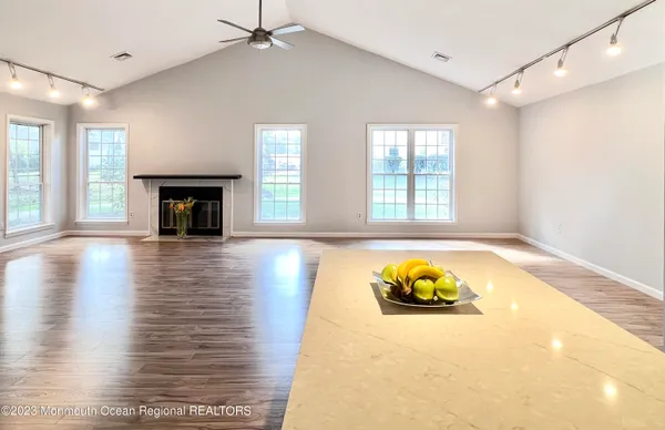 a living room with furniture and a fireplace