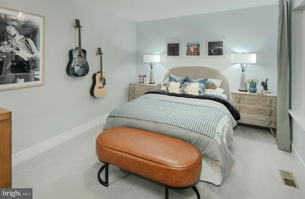 a bedroom with bed and a window