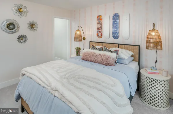 a bedroom with a bed and cabinets