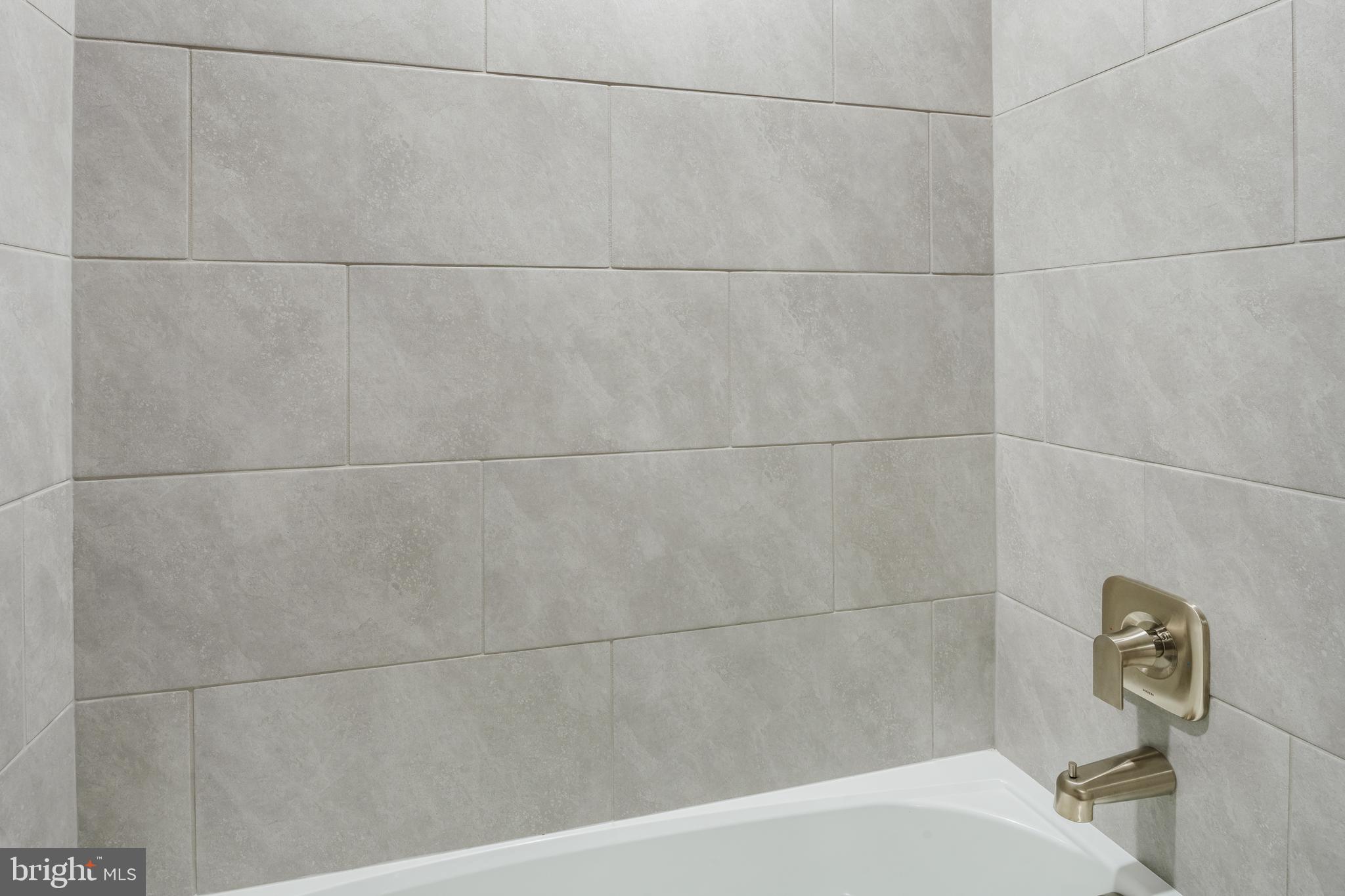 19017 Meadow Sun Way Boyds, MD 20841 - Photo 20 of 34 a bathroom with a bathtub