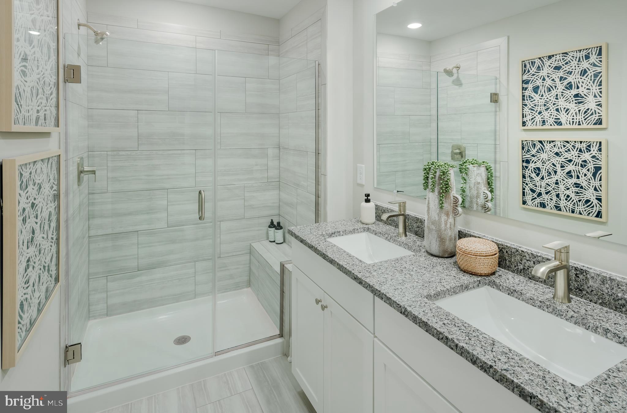 19017 Meadow Sun Way Boyds, MD 20841 - Photo 24 of 34 a bathroom with a granite countertop sink a mirror and shower