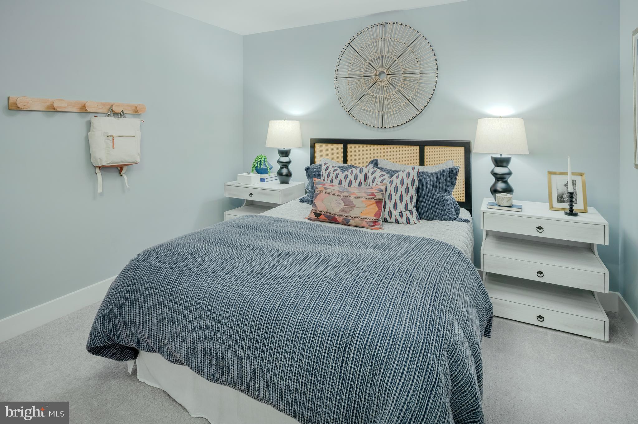 19017 Meadow Sun Way Boyds, MD 20841 - Photo 32 of 34 a bedroom with a bed and a painting on the wall