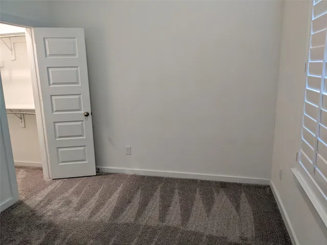a bathroom with a granite countertop tub sink and mirror
