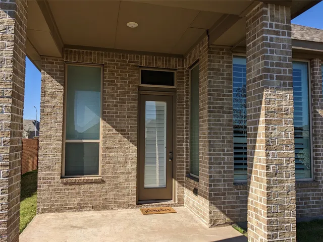 a large kitchen with stainless steel appliances kitchen island a large counter top a stove a sink and a refrigerator