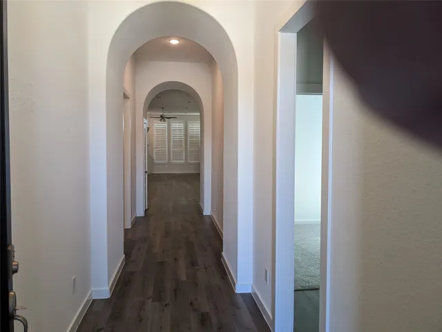 a view of gallery with wooden floor