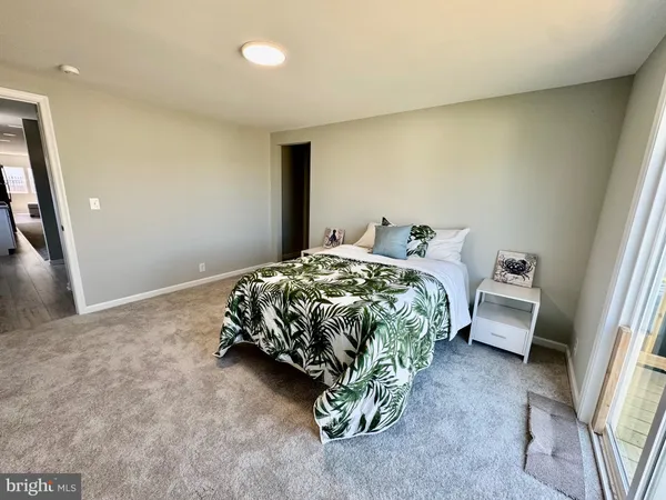 a bedroom with a bed and a couch