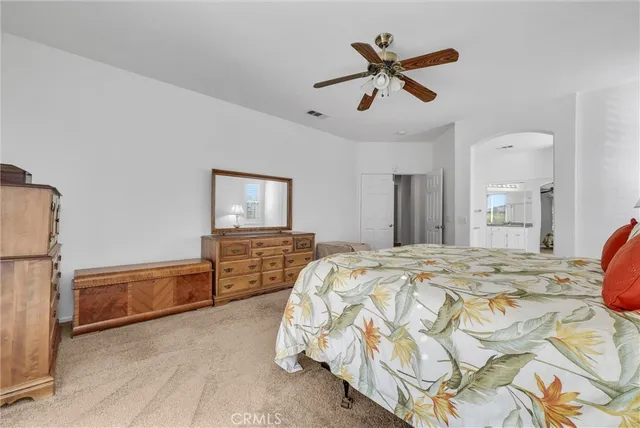 a bed room with a bed and a television