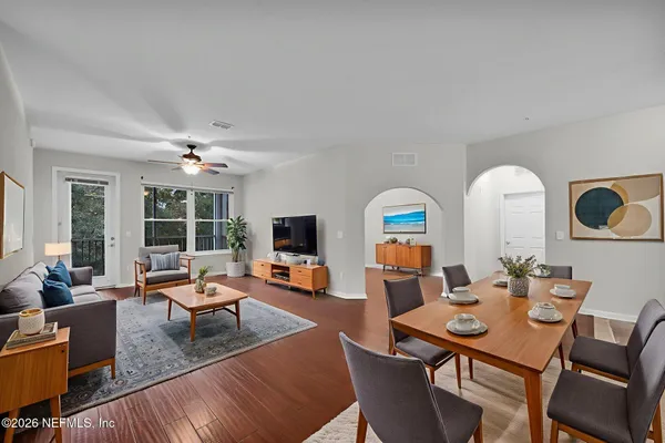 a living room with fireplace furniture and a flat screen tv