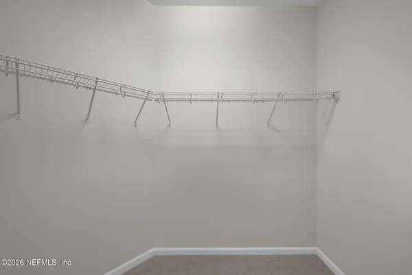 a view of a room with racks on the wall