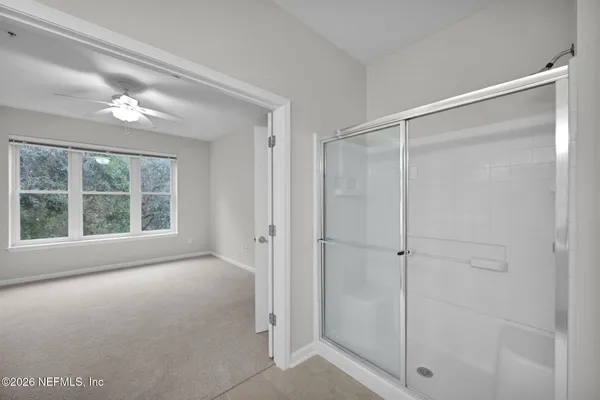 a view of an empty room with a window