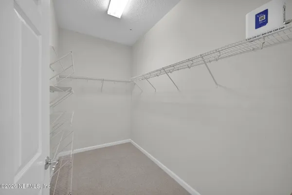 a view of a room with racks on the wall