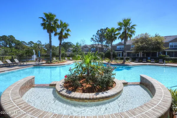 a view of a swimming pool with a patio