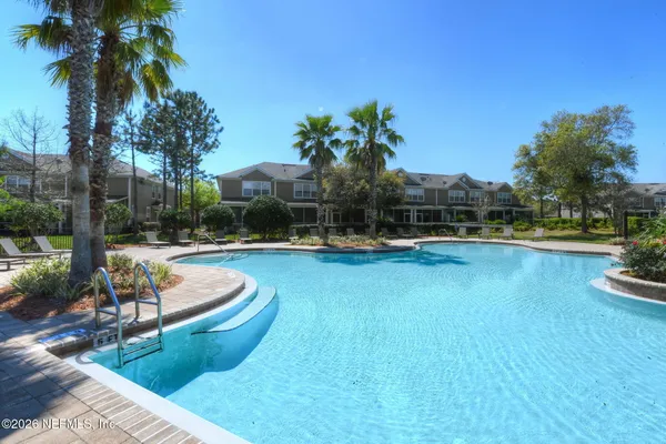 a view of a swimming pool with a patio