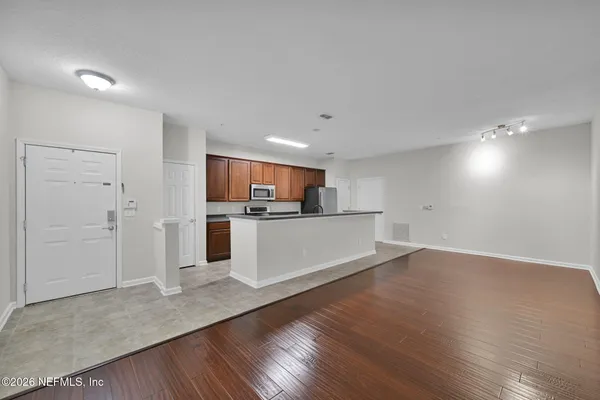 a view of kitchen with wooden floor