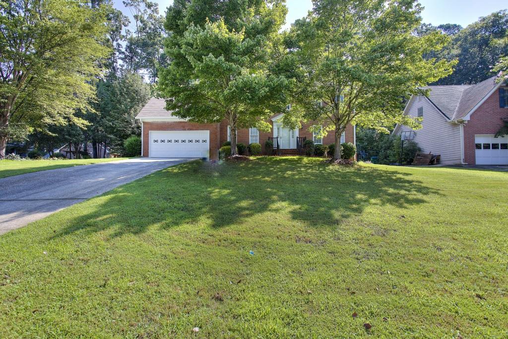 3555 Sims Road Snellville, GA 30039 - Photo 1 of 1 a house view with a garden space