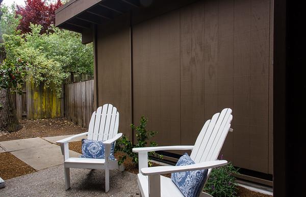 849 Allardice Way Stanford, CA 94305 - Photo 20 of 28 a view of a backyard with table and chairs and wooden fence