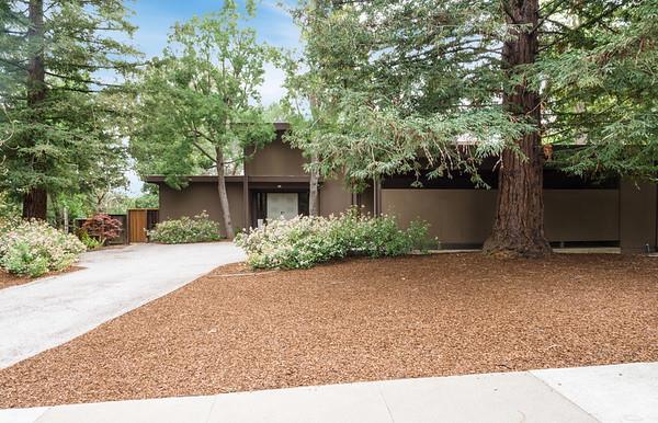849 Allardice Way Stanford, CA 94305 - Photo 2 of 28 a front view of a house with a yard and a garage