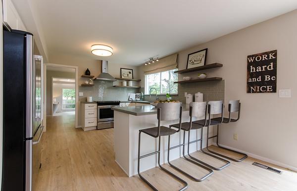 849 Allardice Way Stanford, CA 94305 - Photo 10 of 28 a kitchen with stainless steel appliances kitchen island granite countertop a refrigerator and a stove top oven
