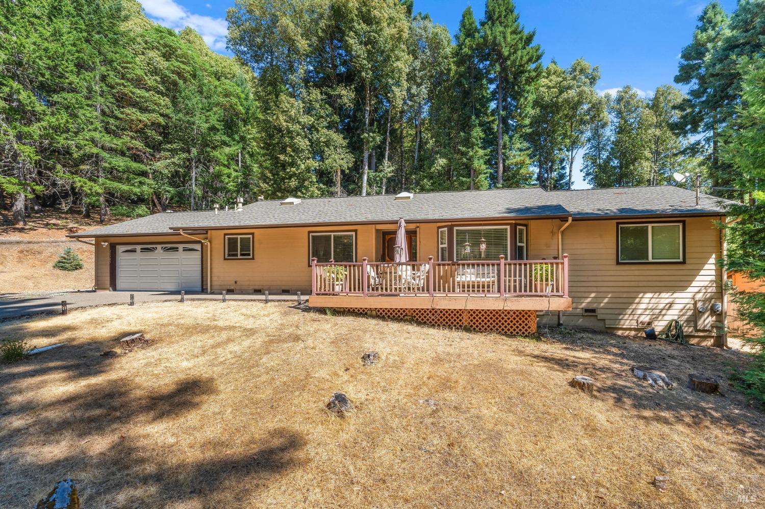 a front view of house with yard outdoor seating and barbeque oven