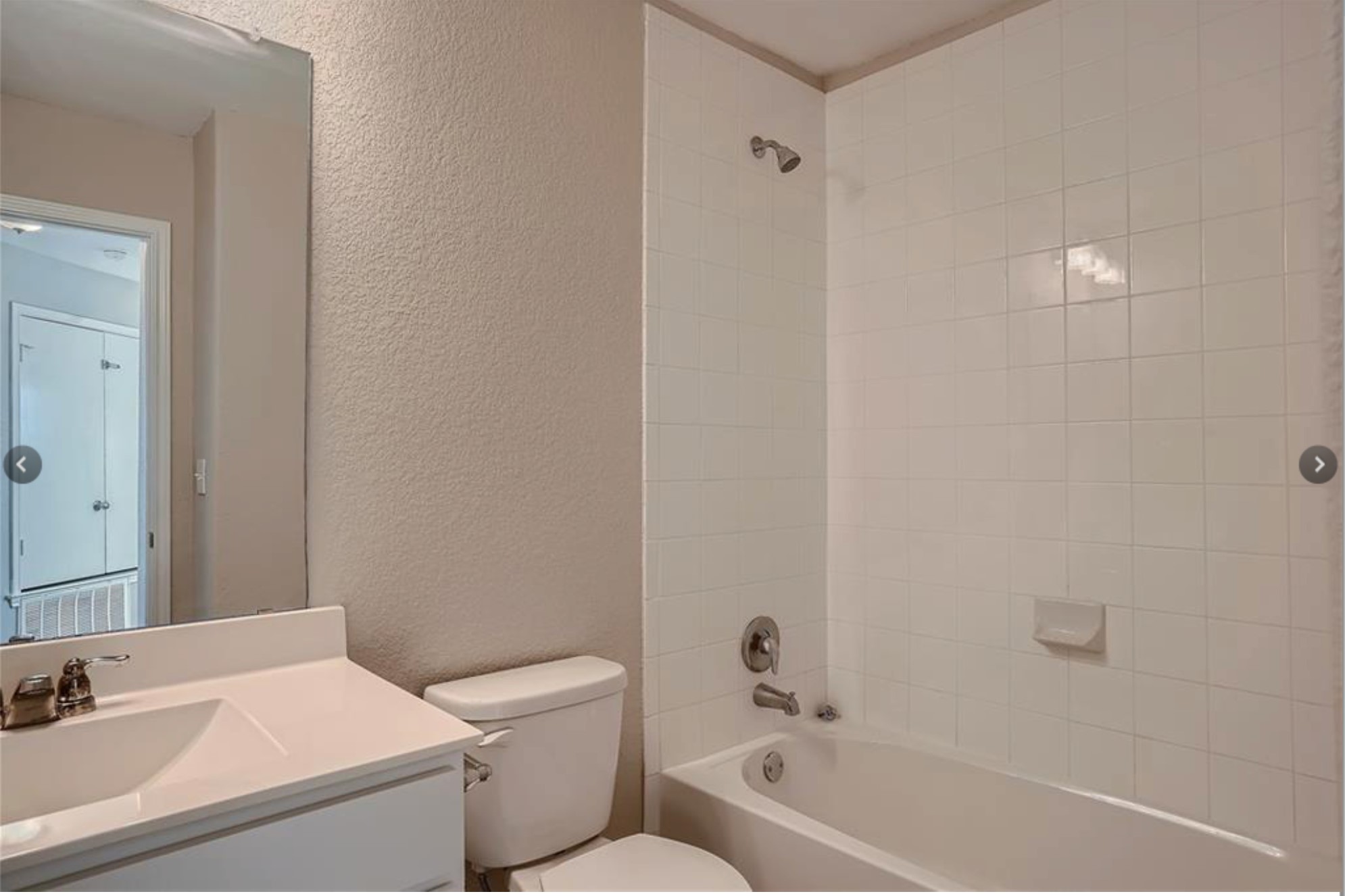 304 Cane River Road Pflugerville, TX 78660 - Photo 25 of 31 A well-appointed bath with a tiled tub/shower combination and a clean, functional vanity.