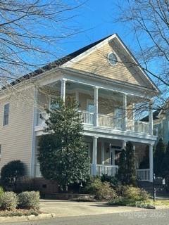 6129 Caseys Side Way, Unit 445 Fort Mill, SC 29708 - Photo 1 of 2 a front view of a house with garden
