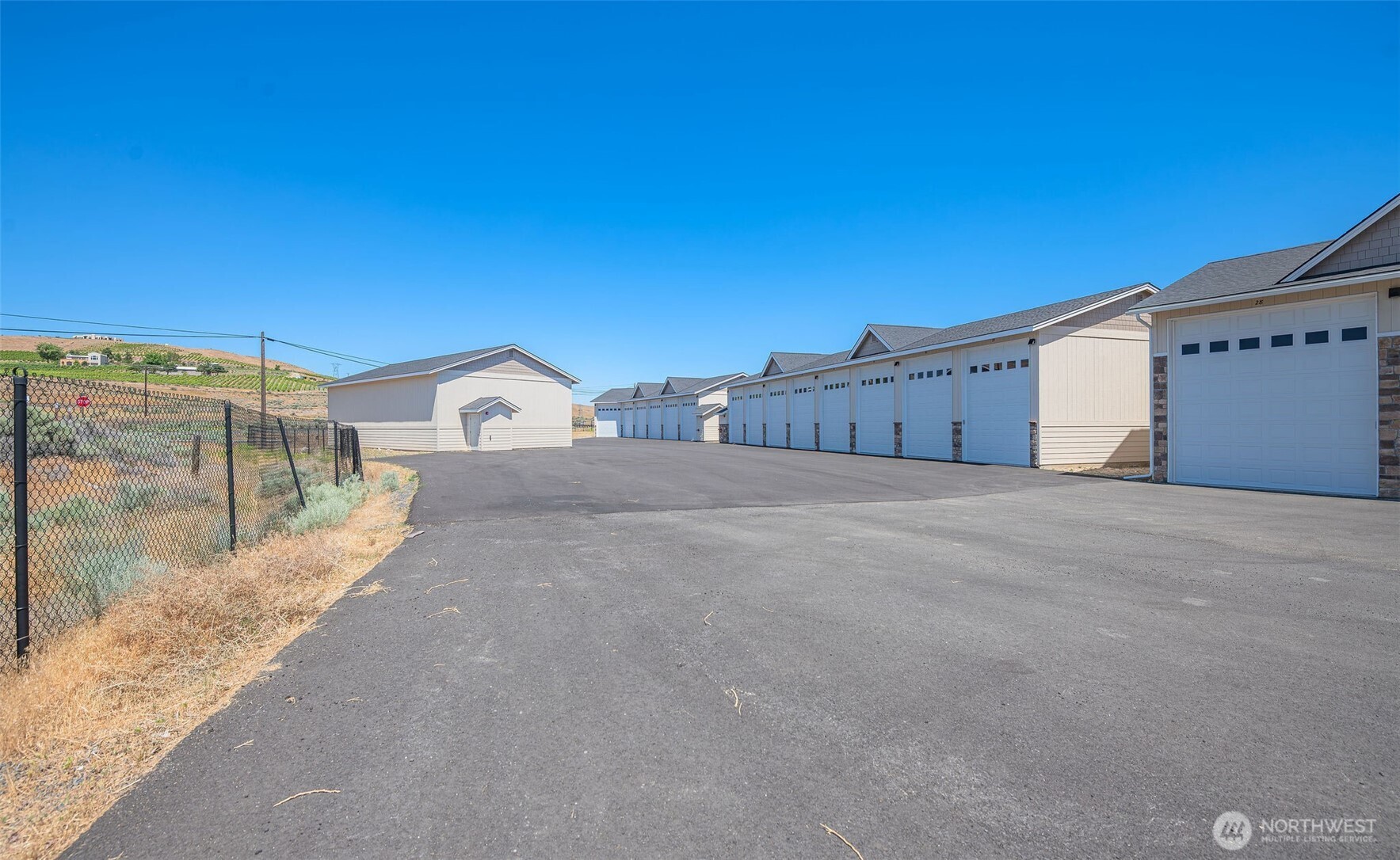 9967 Rd W 8 Northwest, Unit G41 Quincy, WA 98848 - Photo 12 of 27 a view of a road with a building in the background