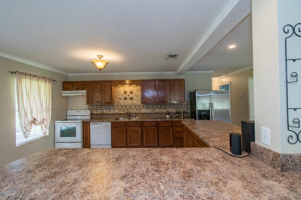 21470 Simoneaux Lane Saucier, MS 39574 - Photo 7 of 40 Kitchen bar 1.3