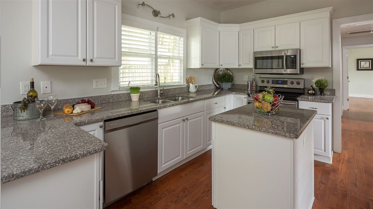 904 East Edenton Street Raleigh, NC 27601 - Photo 2 of 11 The open kitchen offers GRANITE counters, Work Island, STAINLESS STEEL appliances and HARDWOOD floors! KITCHEN