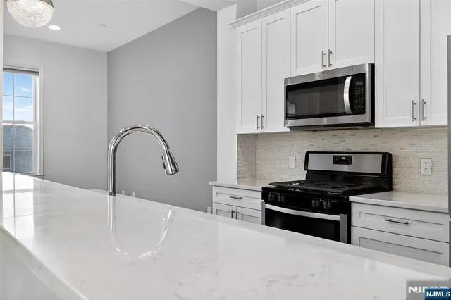 a bathroom with a sink vanity and a mirror