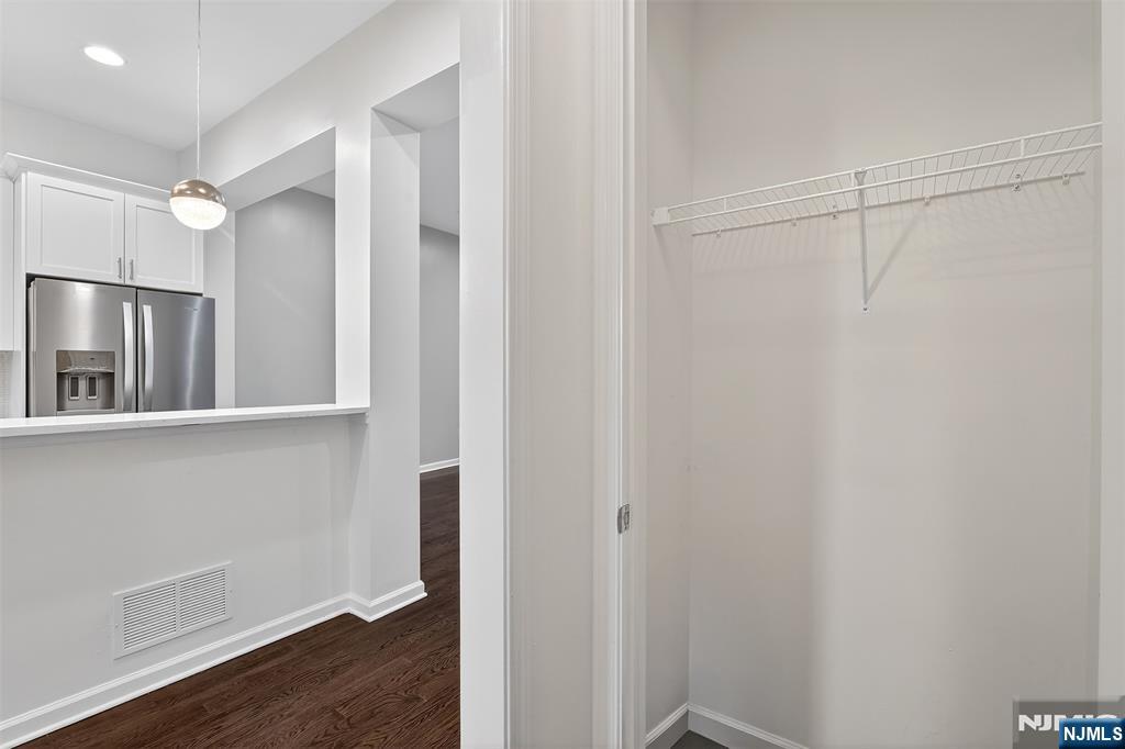 215 Roosevelt Drive Wood-Ridge, NJ 07075 - Photo 21 of 50 a bathroom with a shower and a glass door
