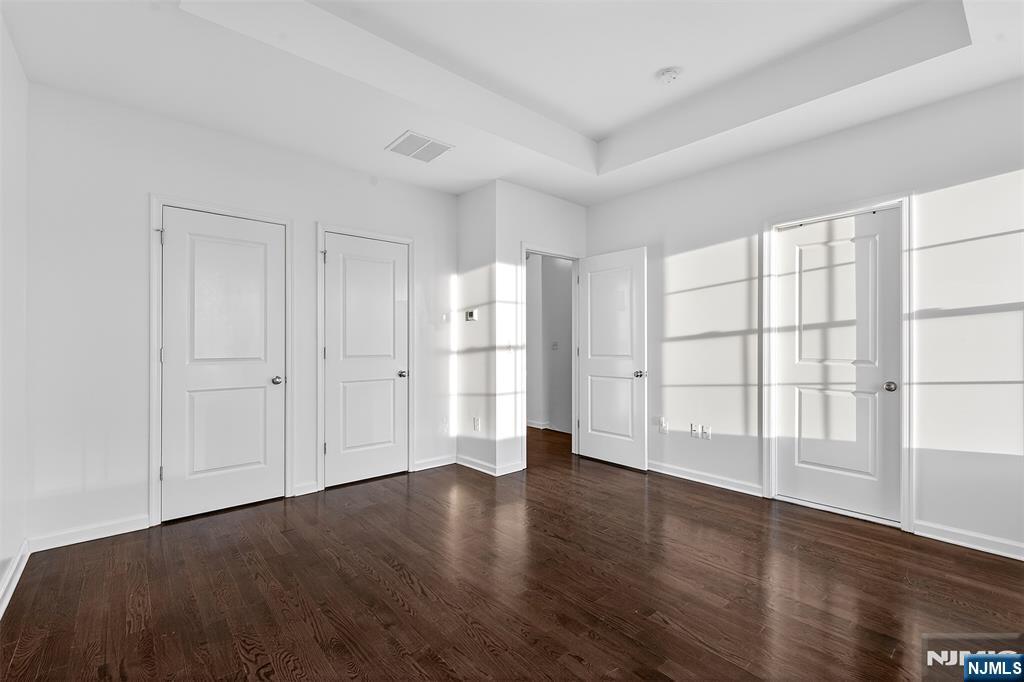 215 Roosevelt Drive Wood-Ridge, NJ 07075 - Photo 24 of 50 a view of empty room with wooden floor and window