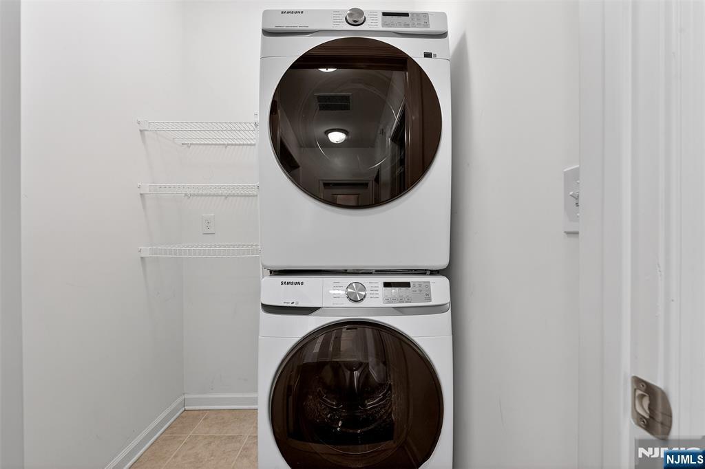 215 Roosevelt Drive Wood-Ridge, NJ 07075 - Photo 31 of 50 a close up view of a washer and dryer