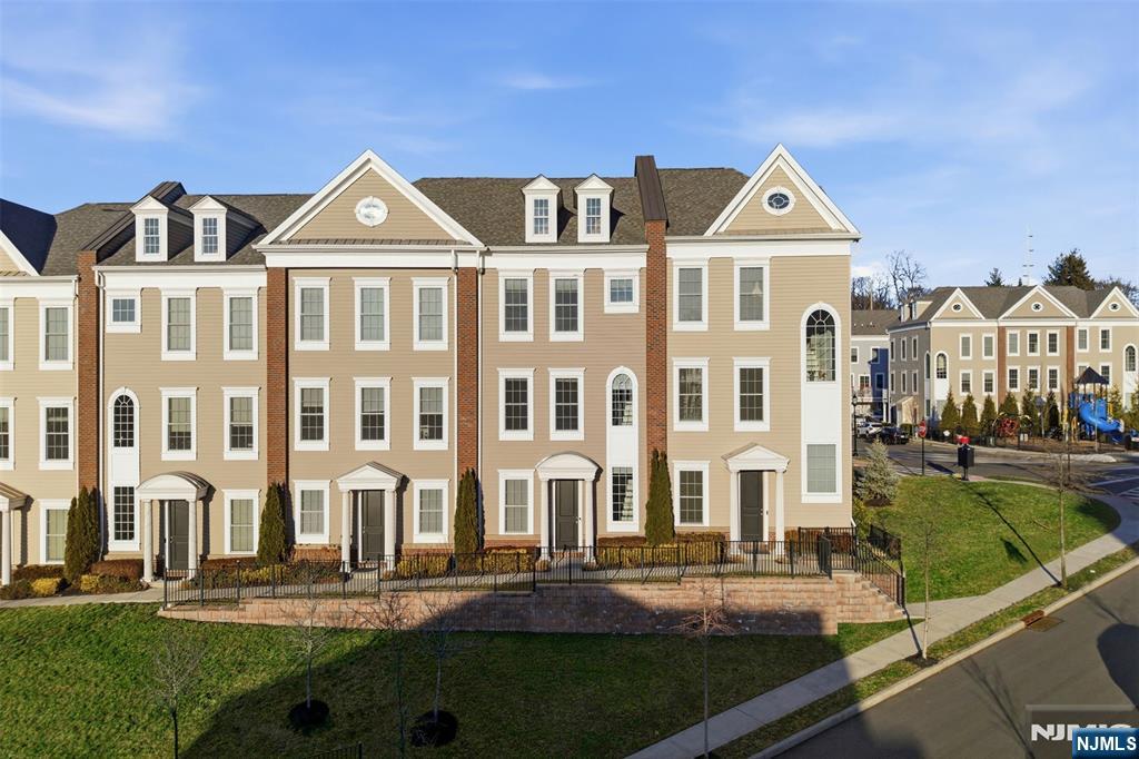215 Roosevelt Drive Wood-Ridge, NJ 07075 - Photo 41 of 50 a front view of residential houses with yard and green space