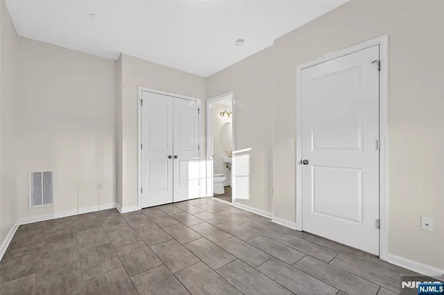 a kitchen with a refrigerator sink and stainless steel appliances