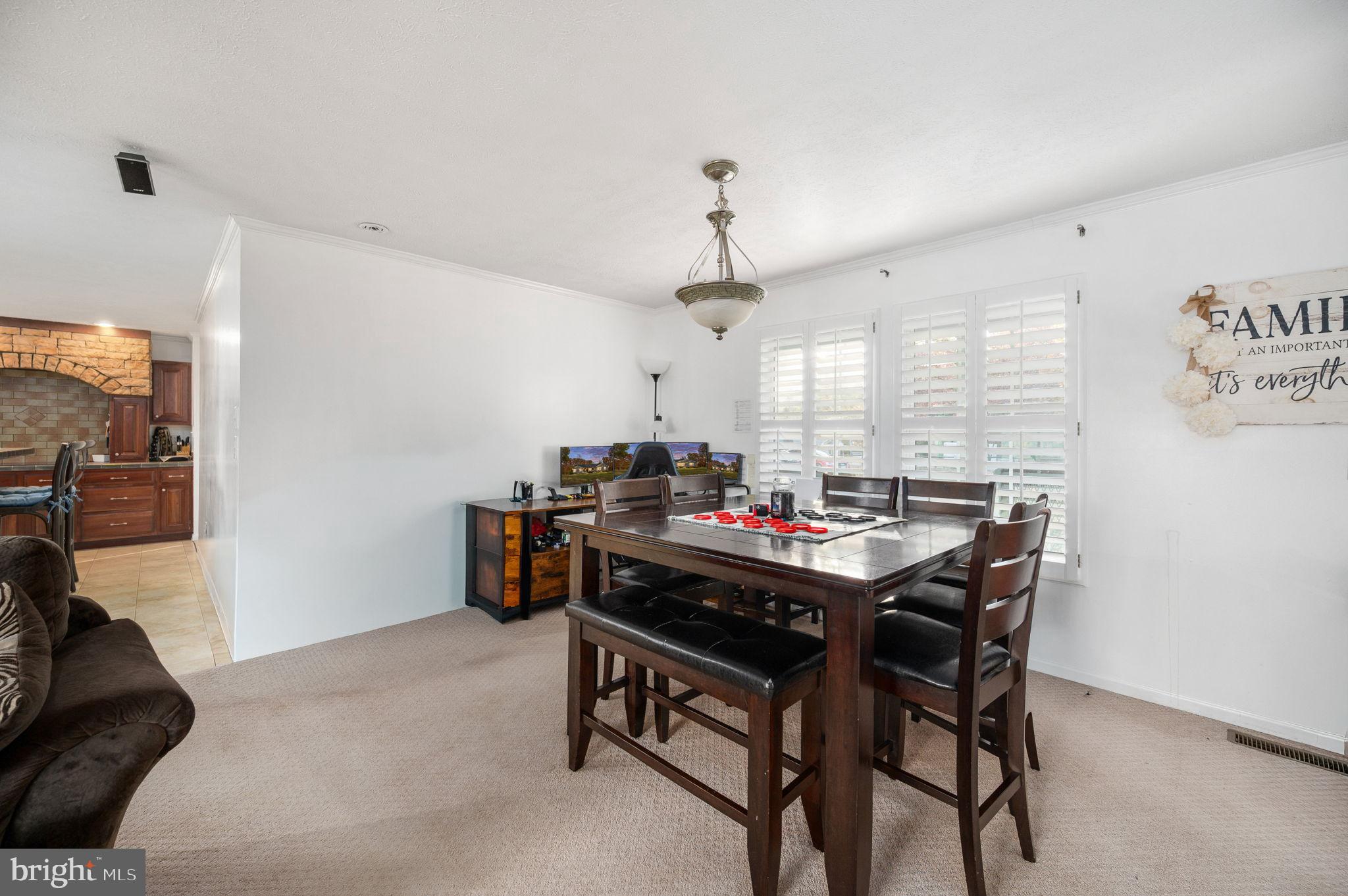 10325 Mill Pond Road Spotsylvania, VA 22551 - Photo 8 of 43 a view of a dining room with furniture