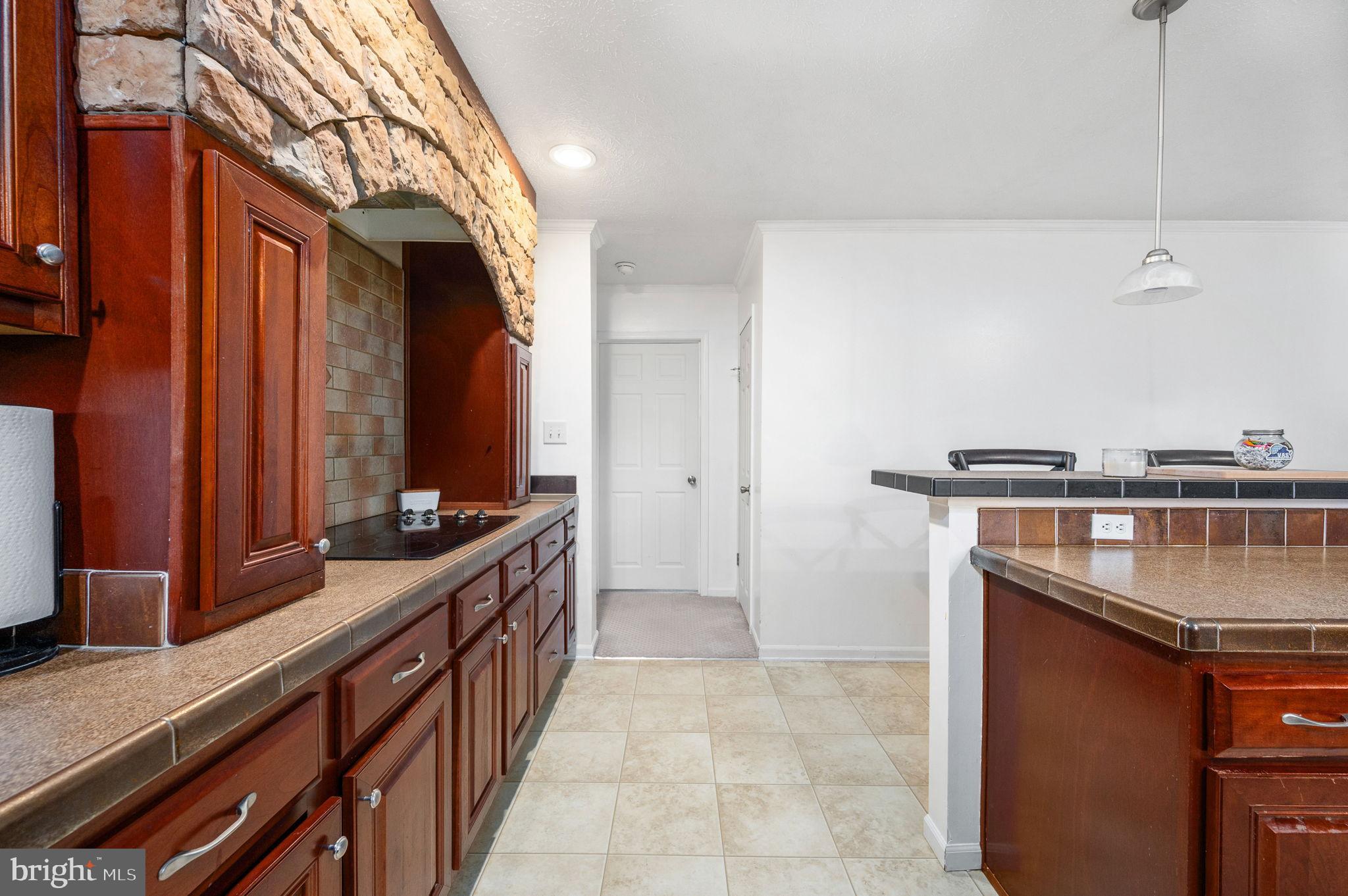 10325 Mill Pond Road Spotsylvania, VA 22551 - Photo 10 of 43 a kitchen with stainless steel appliances granite countertop a sink and a stove