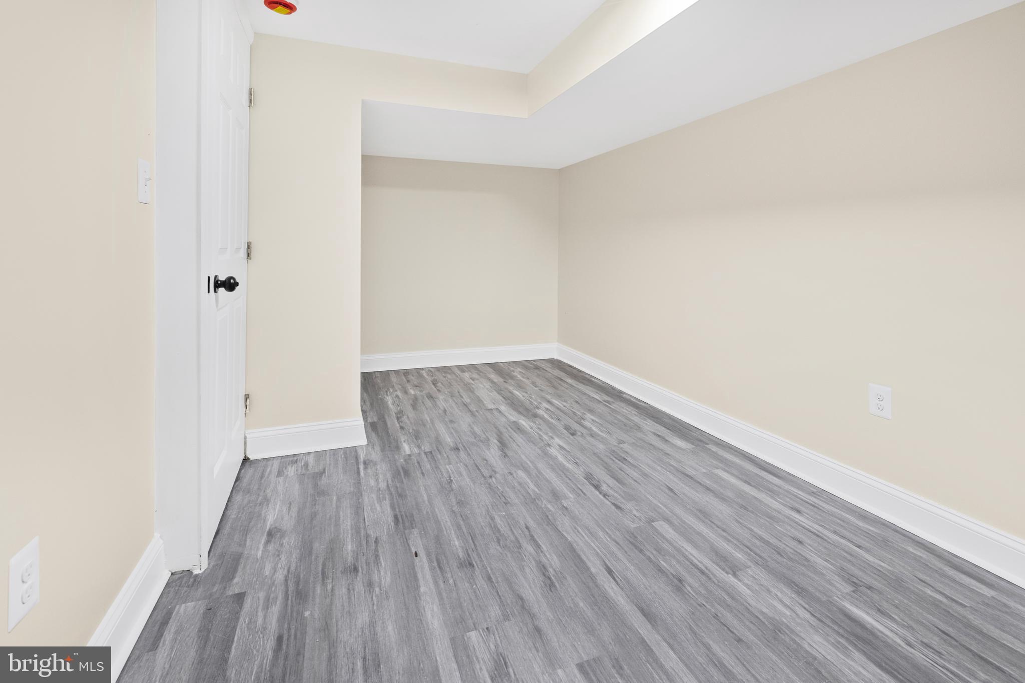 713 Marcy Avenue Oxon Hill, MD 20745 - Photo 17 of 24 a view of an empty room with wooden floor