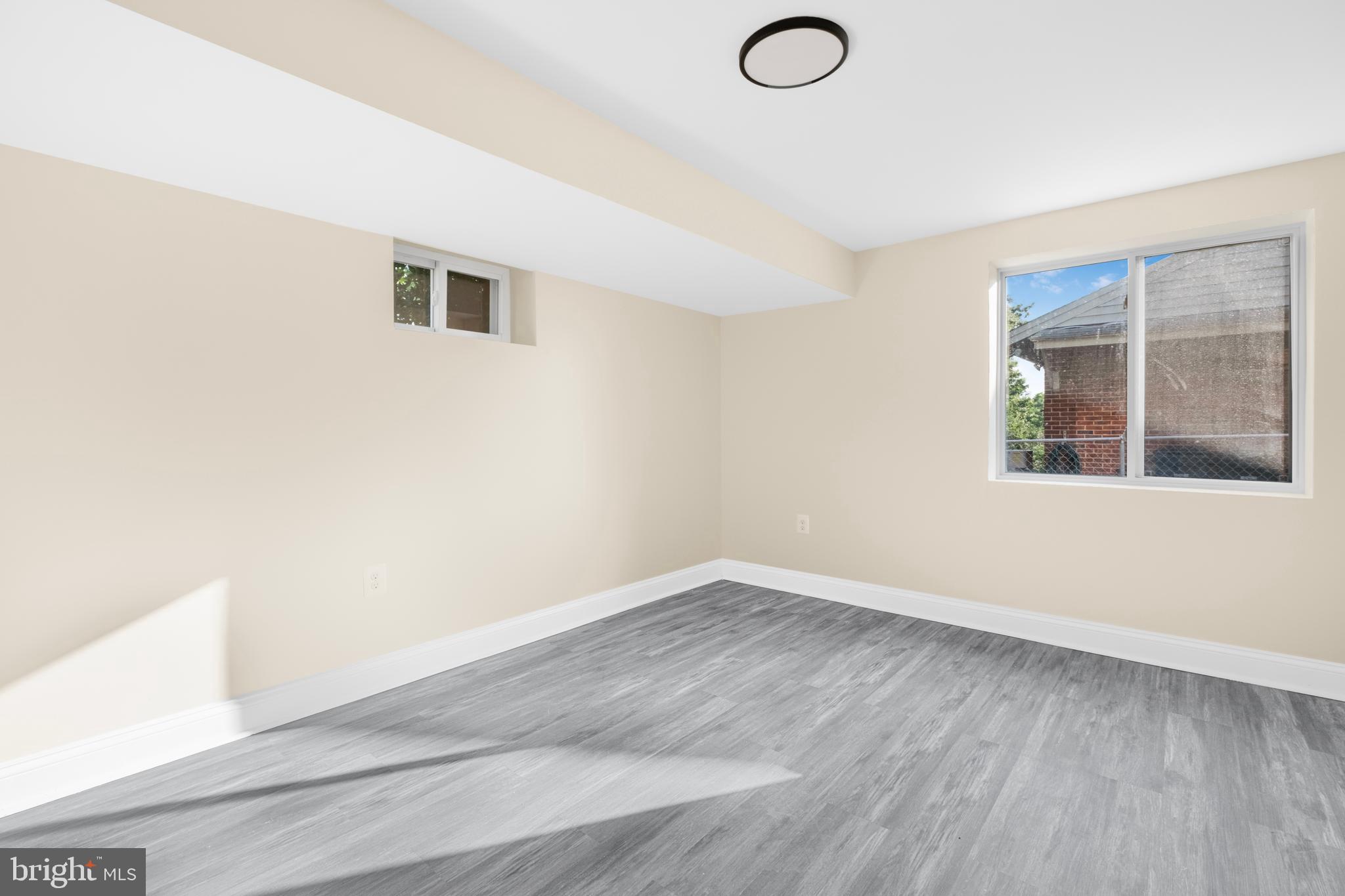 713 Marcy Avenue Oxon Hill, MD 20745 - Photo 18 of 24 a view of empty room with wooden floor