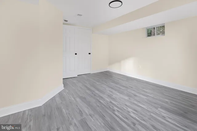 an empty room with wooden floor